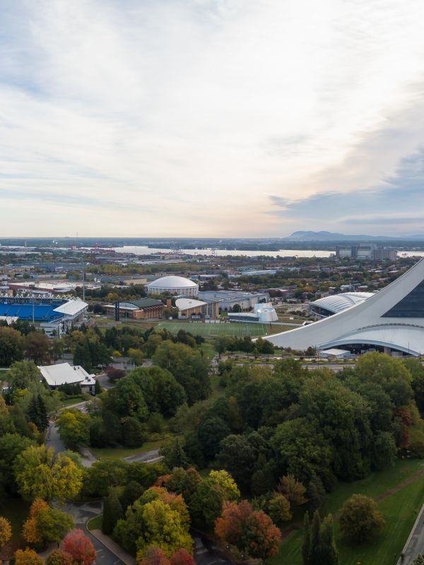 aerial panoramic view of a modern cityscape during a vibrant day during fall season. taken in montreal, quebec, canada.